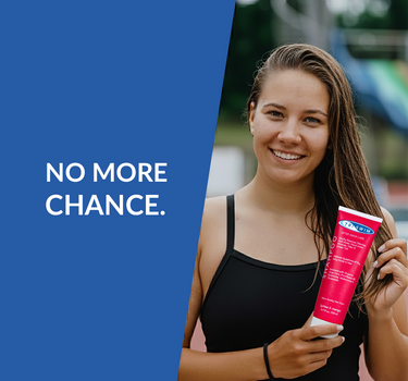 female swimmer with TRISWIM hair care product for chlorine removal
